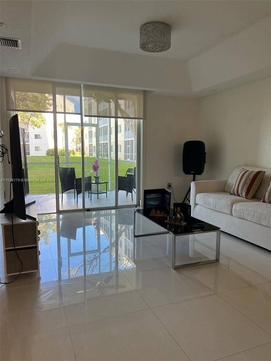 Stunning apartment in the exclusive Doral Isles community, With spectacular amenities with beautiful views and great green area, located on the first level, two bedrooms, plus a den already converted ...