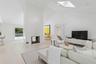 Living room featuring high vaulted ceiling, a skylight, wood finished floors, and a multi sided fireplace
