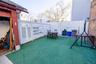 Fenced backyard with a patio area