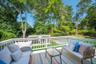 Wooden deck featuring an outdoor living space and an outdoor pool