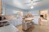 View of kitchen with direct view of informal areas.