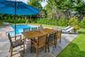 View of pool featuring a yard and a patio