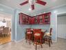 Dining room featuring ornamental molding, light tile patterned flooring, and a ceiling fan