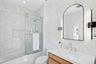 Full bath featuring enclosed tub / shower combo, vanity, and recessed lighting