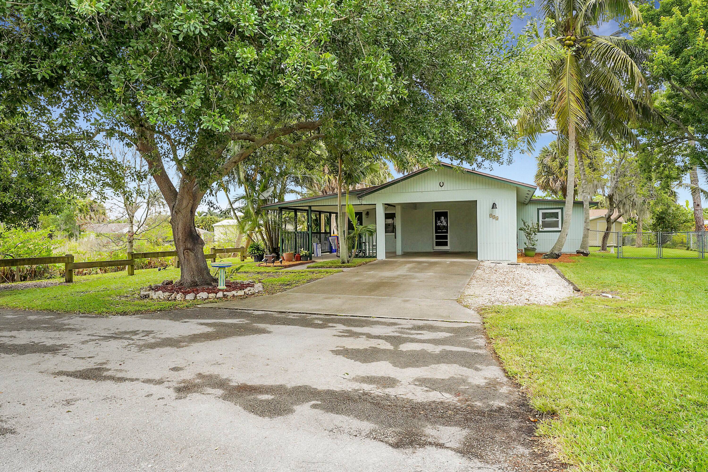 Escape to your own slice of paradise in this charming 3 bedroom, 2 bathroom home nestled in the serene surroundings of Palm City.