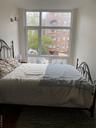 Bedroom with dark wood finished floors