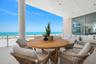 Main floor terrace highlights 40 feet of outdoor living space featuring Longboard™ accents to compliment to azure blue Gulf