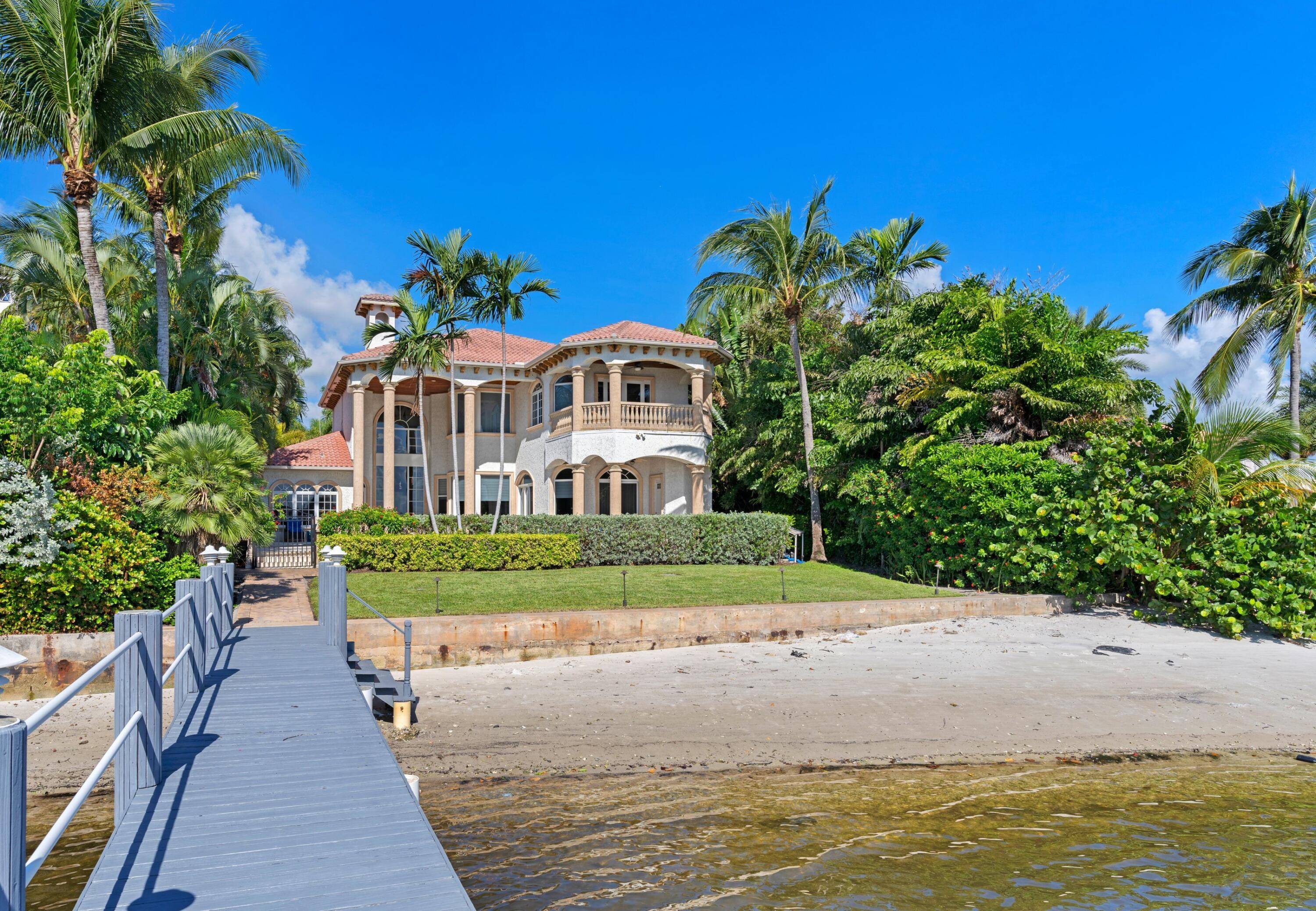 Direct Intracoastal Mediterranean style waterfront home with a private dock, and fabulous views.