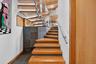 leading to downstairs bedrooms each with private full bath.