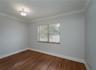 Large room/office/conference room with record room/library.