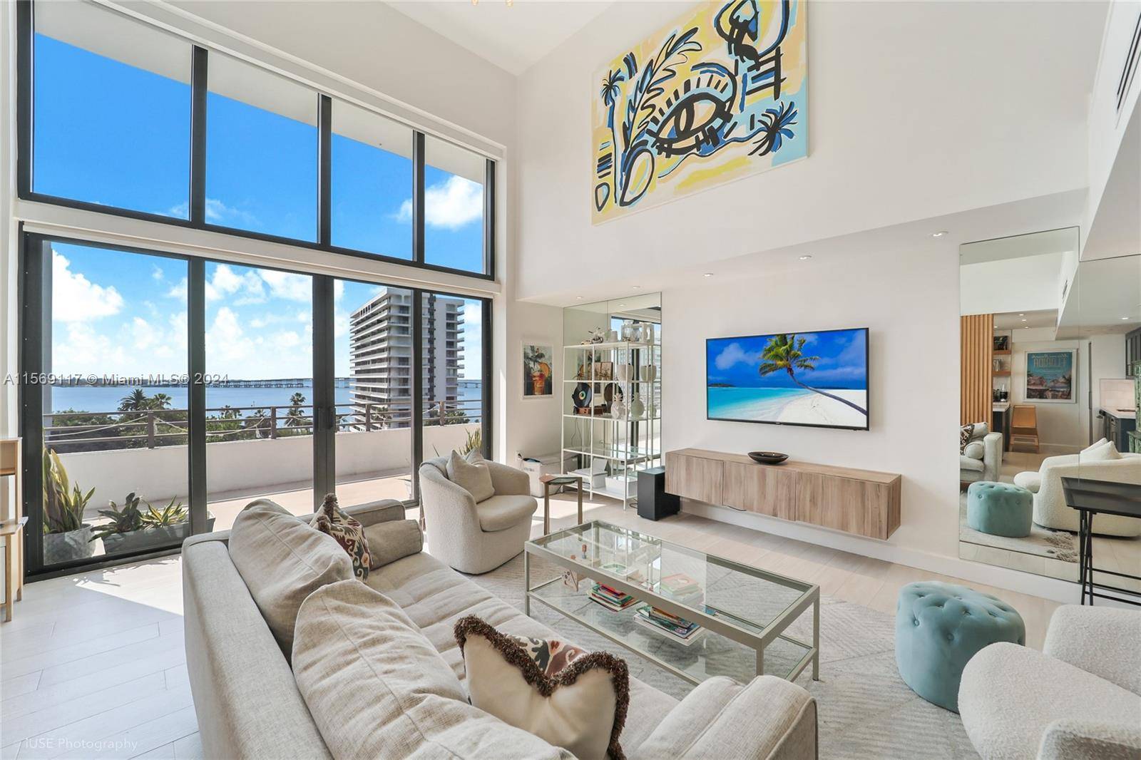Enjoy spectacular ocean views from every room of this stunning loft style apartment, in the exclusive boutique building, Brickell East Condo.