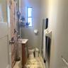 Bathroom featuring vanity and marble finish floors