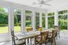 Sunroom / solarium featuring crown molding and a healthy amount of sunlight