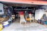 Garage with freestanding refrigerator