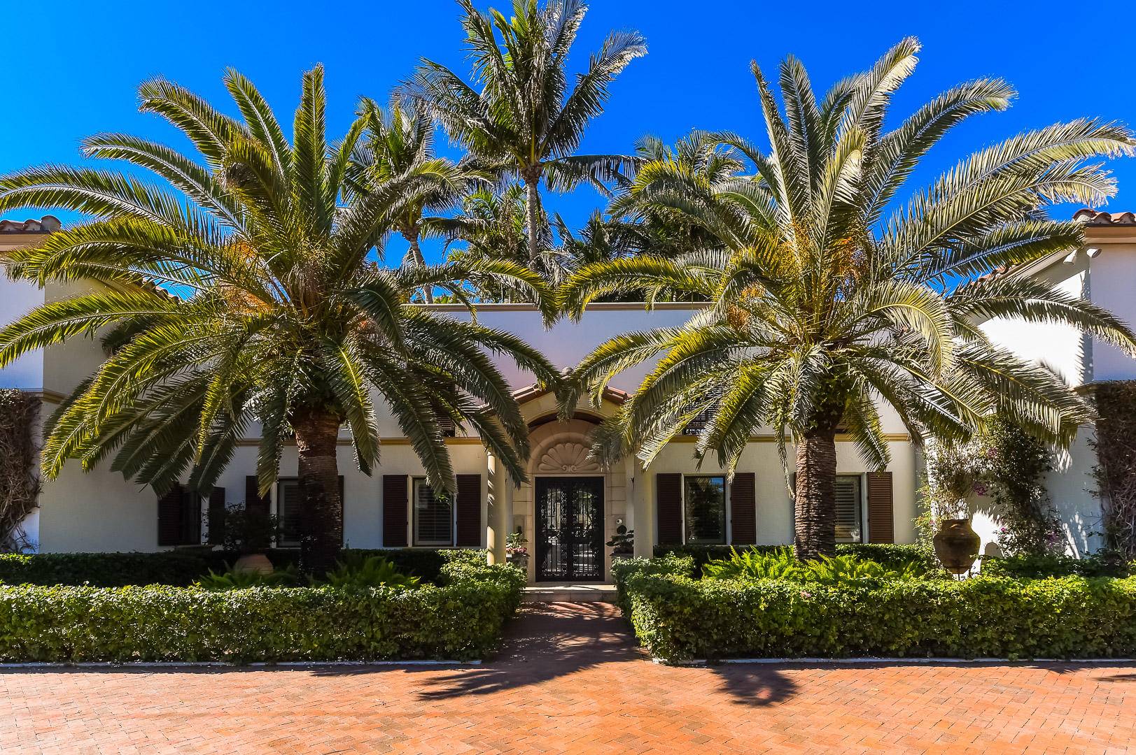 Magical estate compound, 3 4 acres hidden on the north end with 133 feet of direct intracoastal frontage sitting directly on the water with deep water dock.