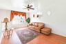 Living area featuring light wood finished floors and ceiling fan