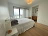 Bedroom with baseboards and light wood-style floors