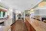 Beautiful chefs kitchen with granite countertops and stainless steel appliances.