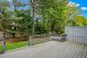 Spacious outdoor deck with natural wood-finish flooring and matching railings