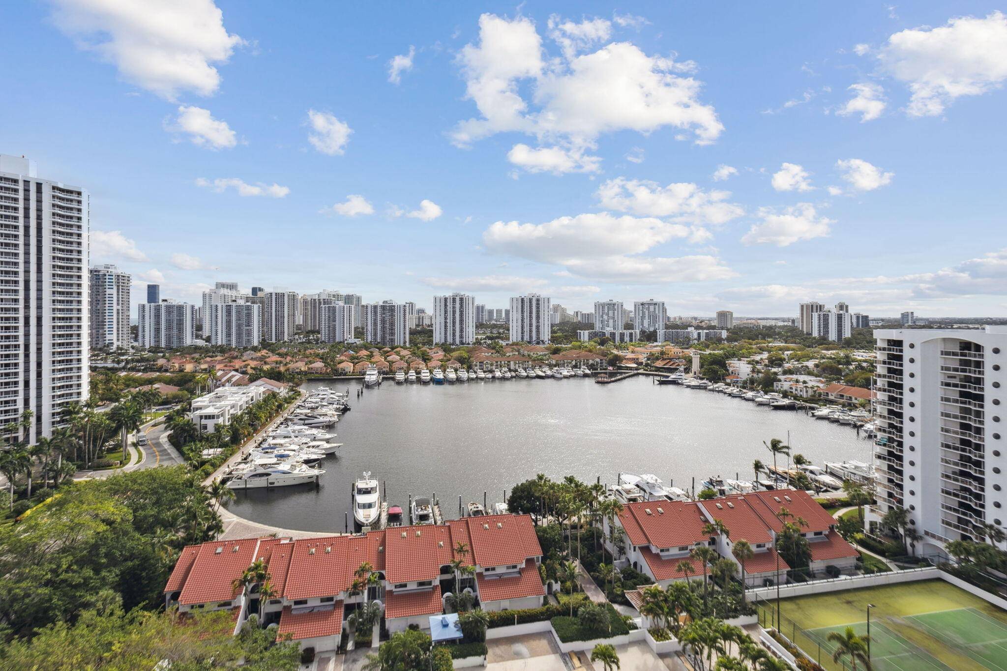 Unit 1706, poised on the 17th floor, presents an exceptional living experience accentuated by its corner positioning, offering breathtaking views of the ocean and water canals.