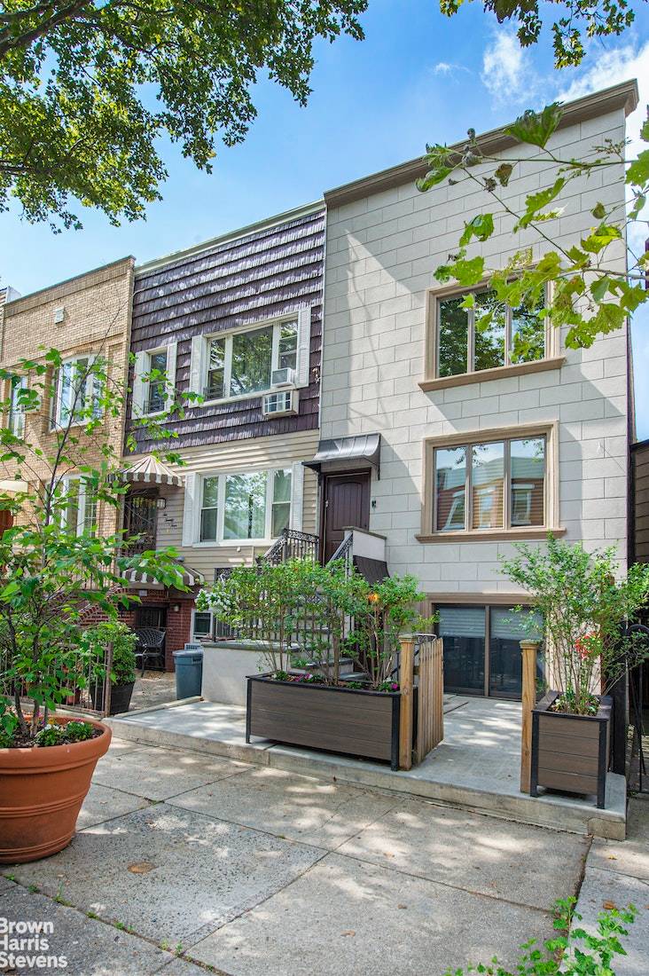 This triple mint Greenwood Heights home boasts five bedrooms, 3.