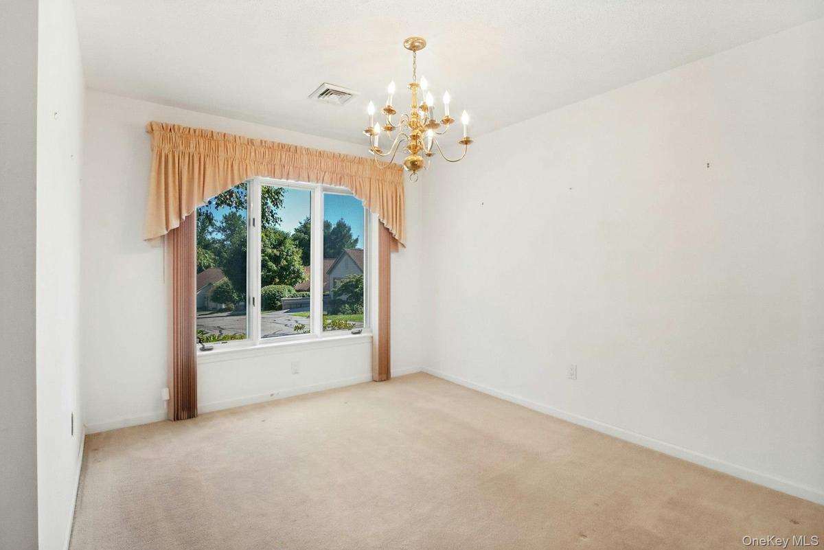 Separate dining room with chandelier included