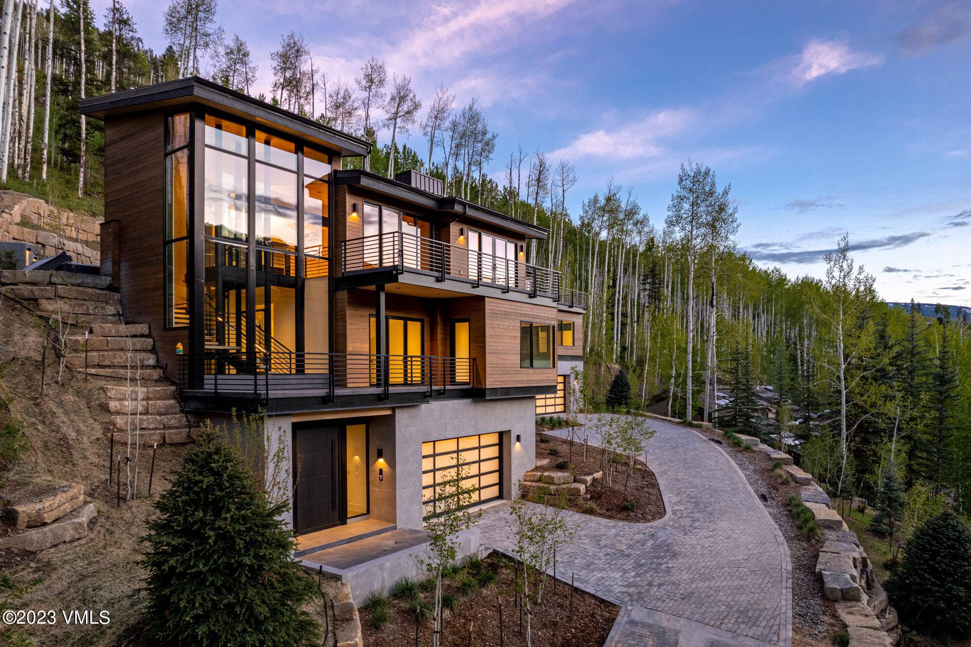 Situated high in the sought after Cascade Village neighborhood, 1469 Greenhill Court East is the secondary side of a new construction mountain modern residence.