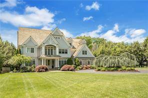 This magnificent colonial is sited perfectly on a flat 1 acre lot in the hunt club neighborhood.