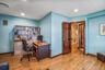Office area with light wood-type flooring and recessed lighting