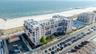 Drone / aerial view with a water view and a beach view