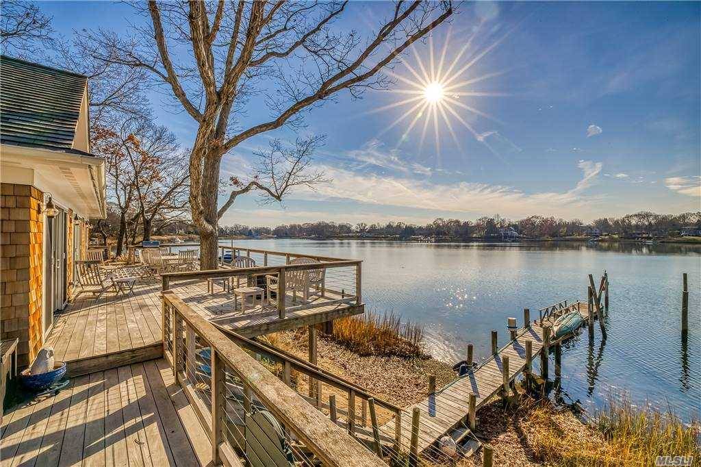 This stunning freshly renovated waterfront home with detached guest apartment and garage could be your new refuge.