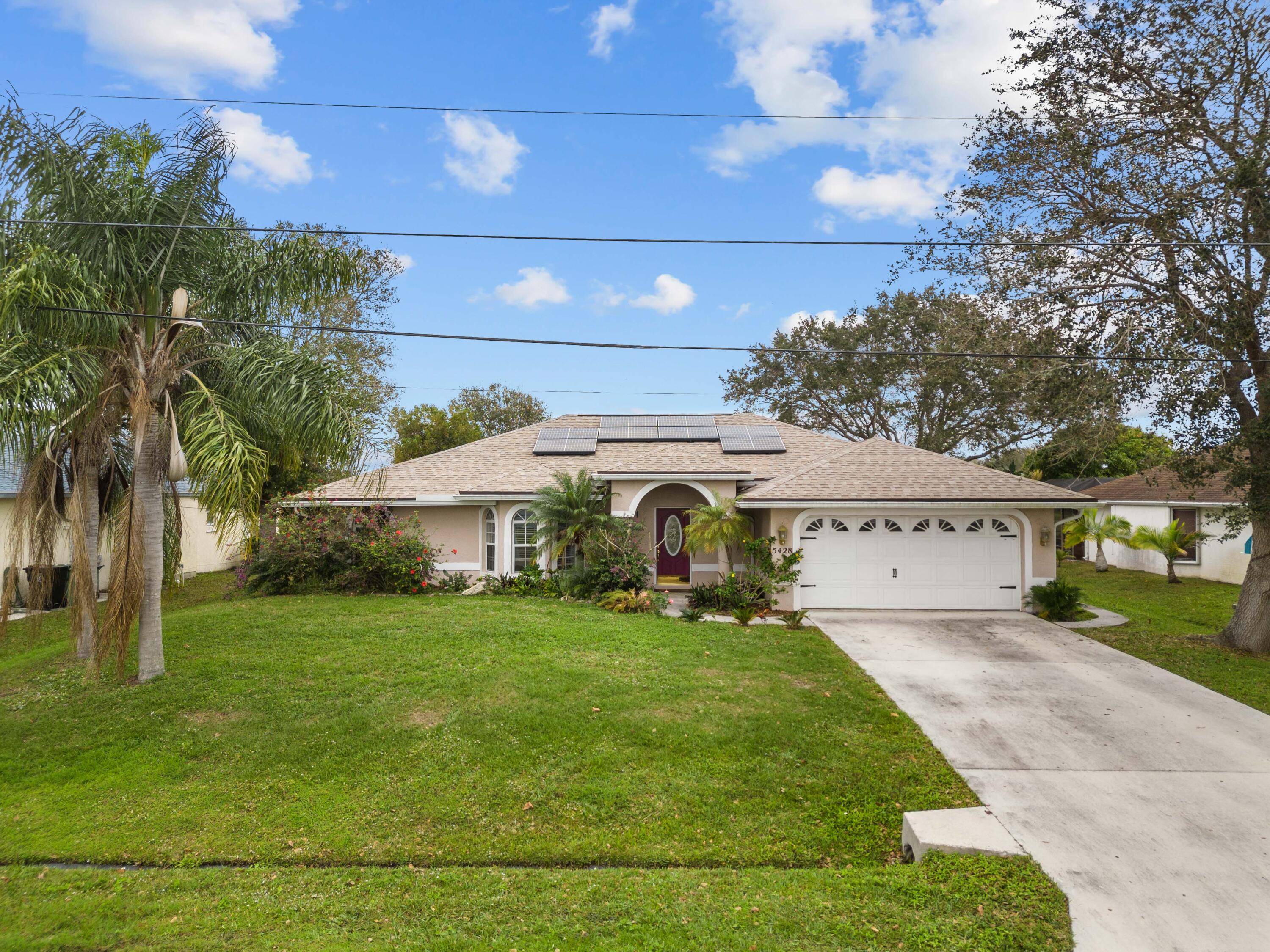 RARE ! Waterfront Spacious Beauty, over 2, 000 sq ft CBS home, No HOA, 4 bedrooms, plus an additional waterfront office with a separate entrance off the screened patio.