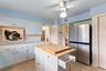 Reverse view of kitchen. Doorway to the back left leads into the informal areas