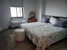 King Sized Bedroom featuring ocean views