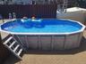 Above ground pool with deck. Refreshing on a hot summers' day!