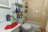 Bathroom with shower / tub combo with curtain and tile patterned floors