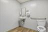 Bathroom featuring light wood-style floors and a paneled ceiling