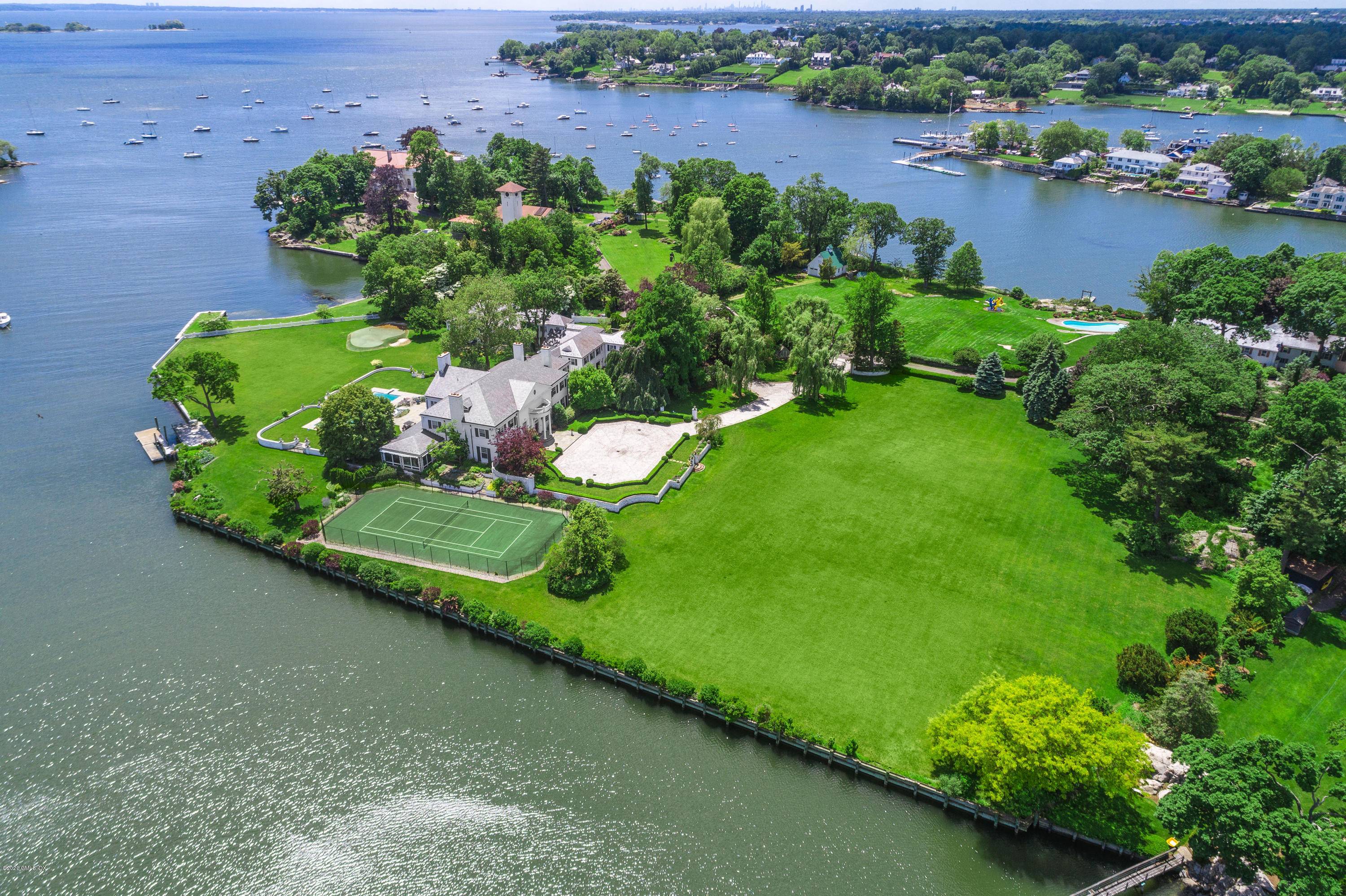 In the exclusive guard gated Indian Harbor association, this exceptional compound is one of Greenwich's most significant direct waterfront estates on 3 existing parcels in the R 20 zone.