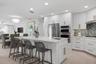 Kitchen with Breakfast bar island and stainless appliances