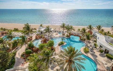 Experience the allure of coastal elegance with this stunning condo hotel apartment in Sunny Isles a sexy fusion of investment savvy and beachfront bliss !