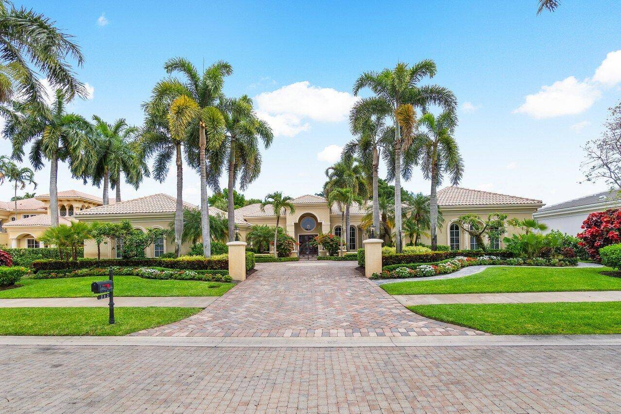 Spectacular estate home in the exclusive enclave of Grand Pointe in BallenIsles Country Club !