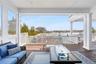 Covered Backyard Deck with Seating and Gas Fireplace