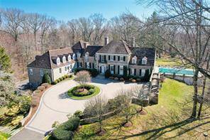 Beautifully sited on 4 private acres is a spectacular 1930 Georgian stone manor home with every amenity one could wish for.