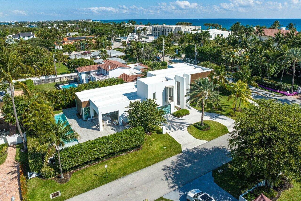RESIDENCE A cohesive interplay of rich stone, pristine white stucco and gleaming glass, this tropical Contemporary style residence, designed with simple, clean, rectilinear lines by architect George Brewer, offers a ...