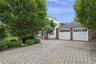 Beautiful double wide paver driveway accessed from Plumtree Lane