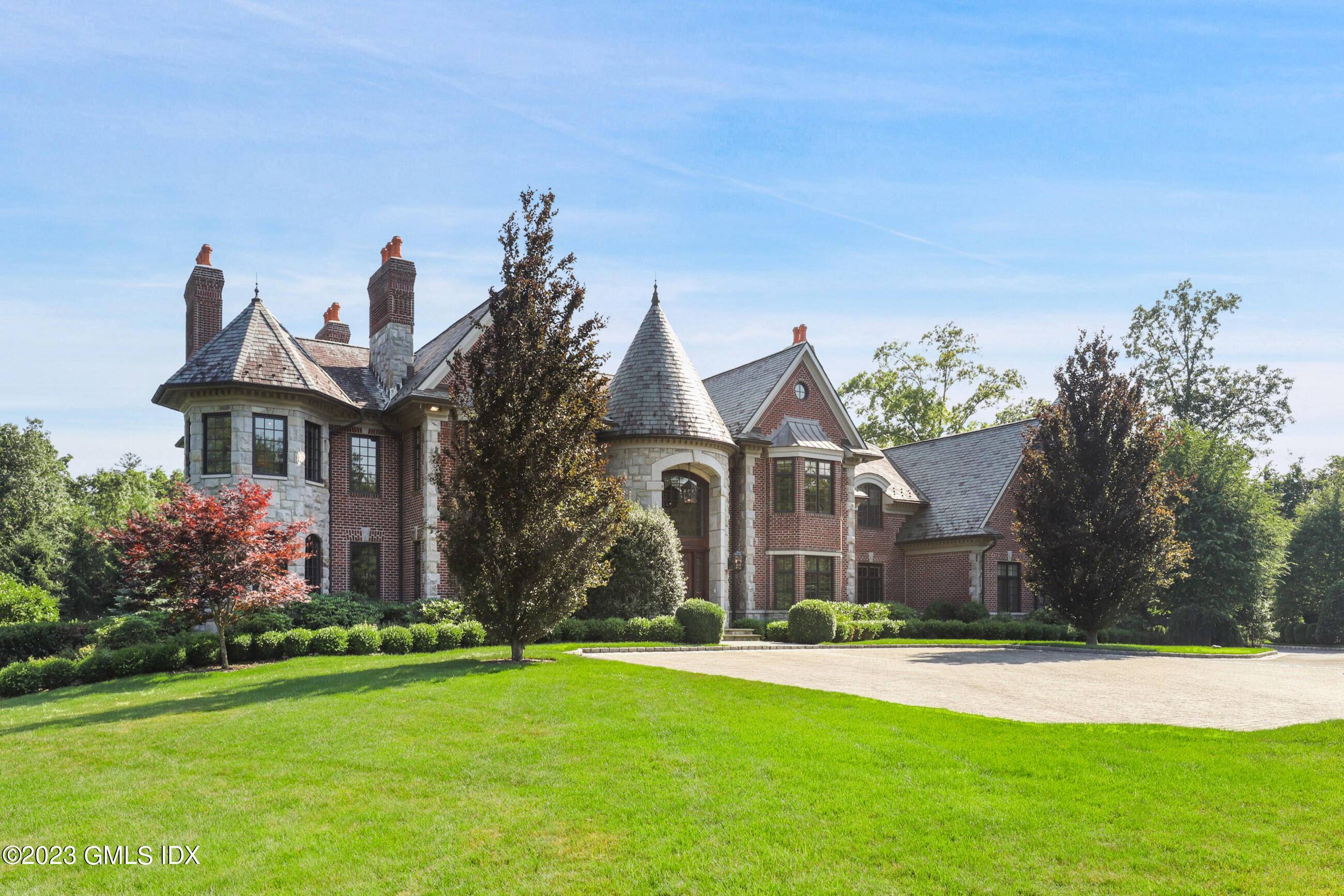Custom built stone and brick manor with old world charm and character.