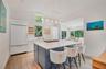 Beautiful new kitchen with quartz counters, Sub-Zero refrigerator, Wolf Range and microwave and Bosch Dishwasher.