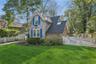 View of front of property featuring roof with shingles