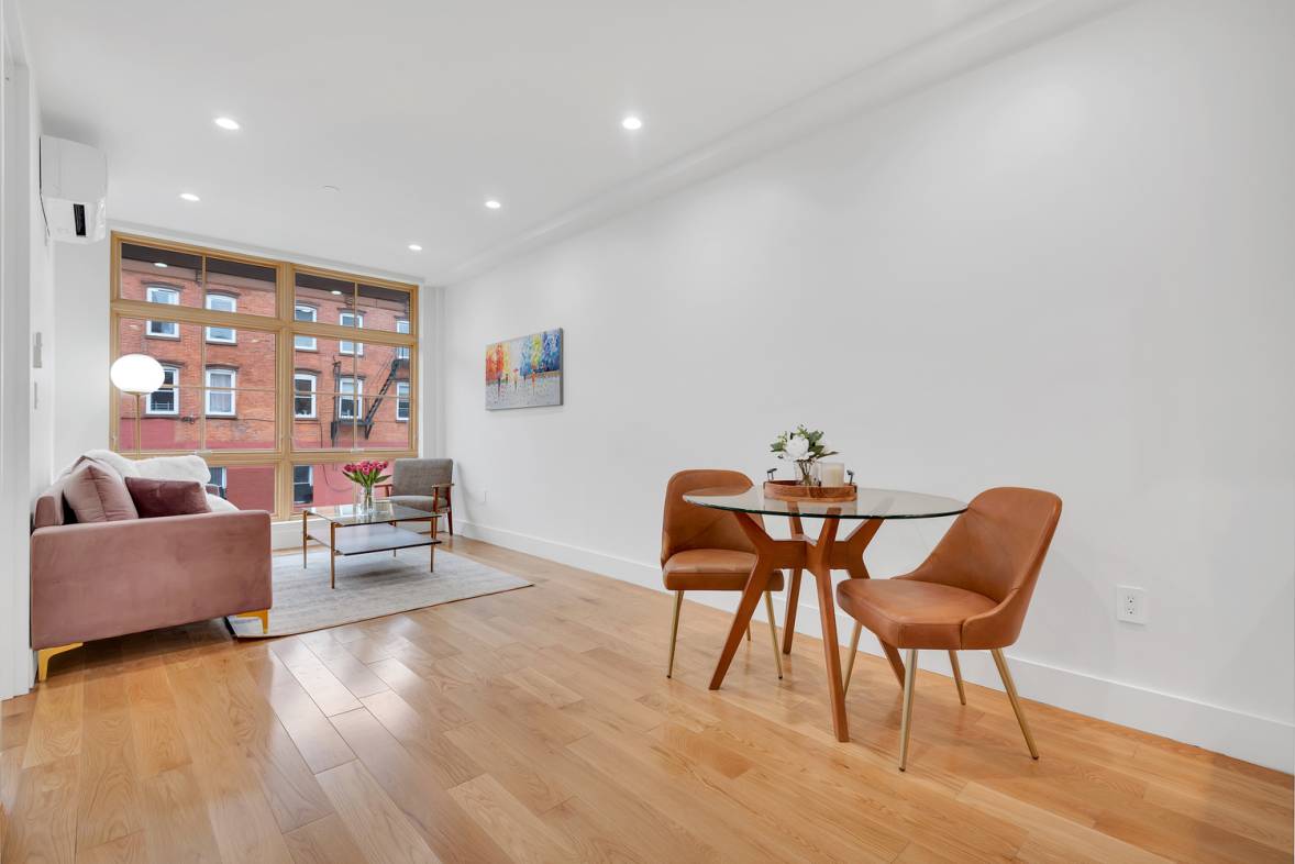 Welcome home to unit 1A ; an expansive, south facing duplex studio apartment.