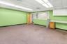 Spare room with a drop ceiling and light colored carpet